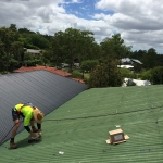 Preparing the mounting feet for a solar power install in Indooroopilly